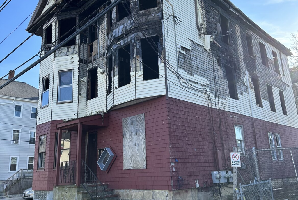 Fire damaged three family house in southeastern Massachusetts