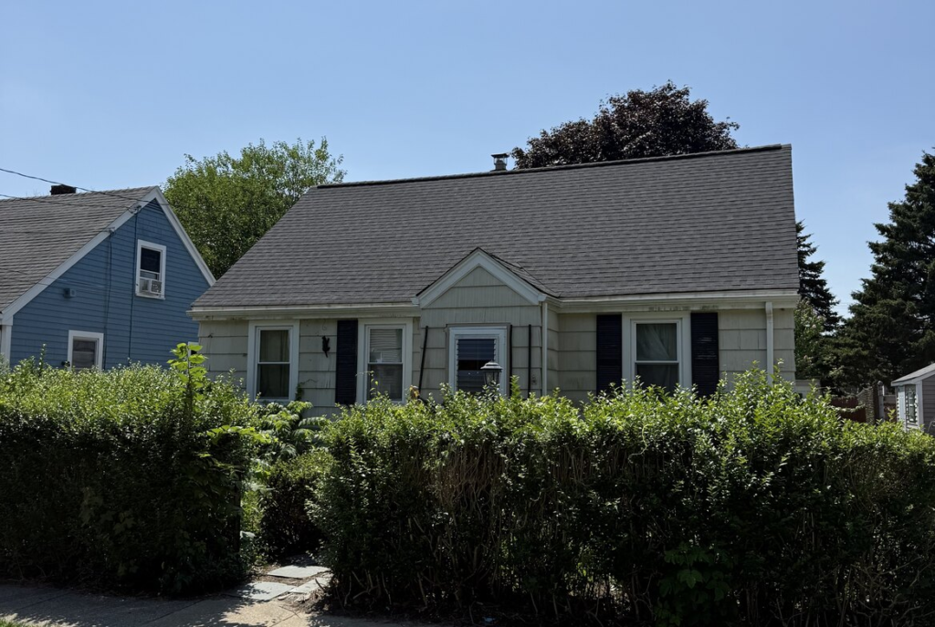 Cape behind an overgrown hedge in southeastern Massachusetts