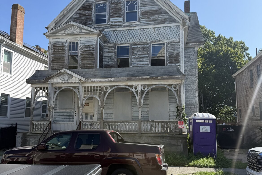 Boarded three story Victorian house in southeastern Massachusetts